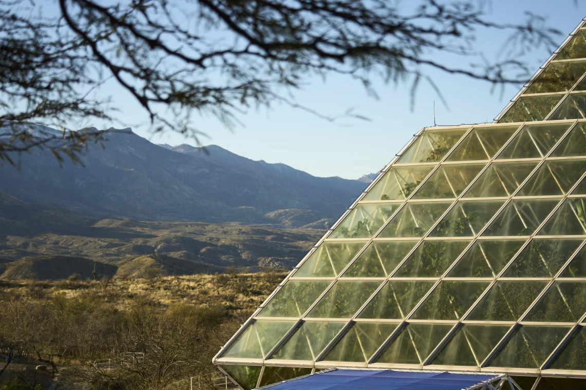 Biosphere 2 against a backdrop of the Catalina mountains